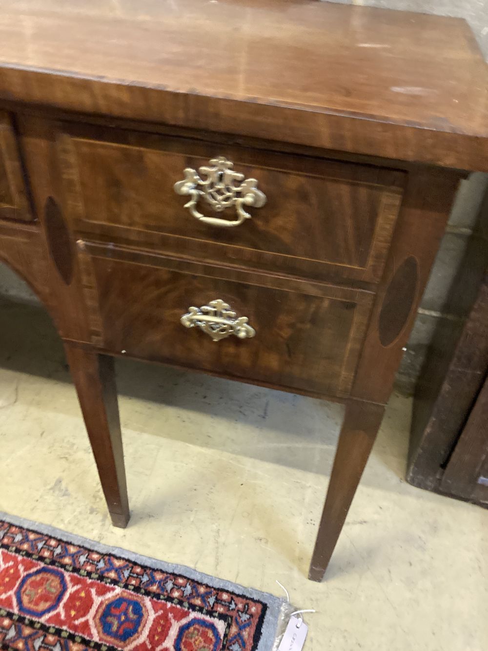 A George III mahogany crossbanded sideboard, width 153cm depth 64cm height 86cm